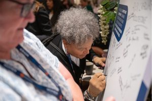 Signing the Women in Bus and Coach Pledge board