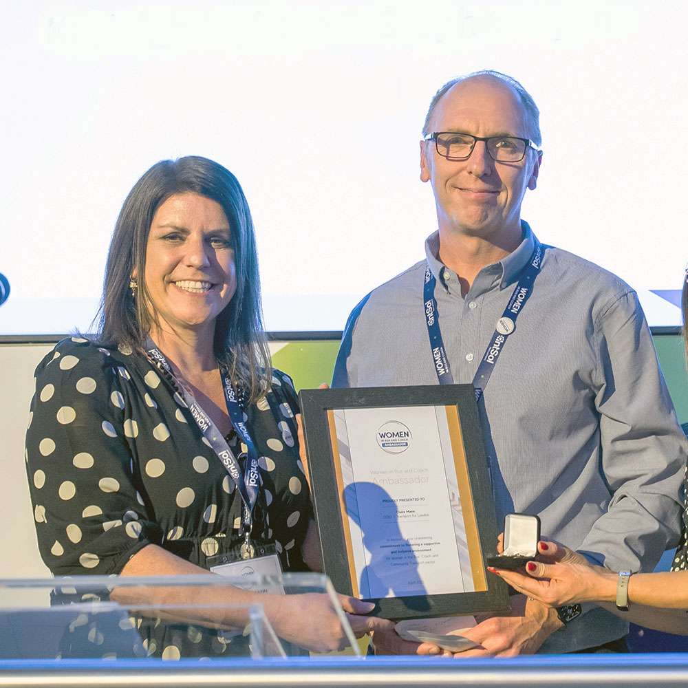 Claire Mann Women in Bus and Coach Ambassador receiving certificate and badge