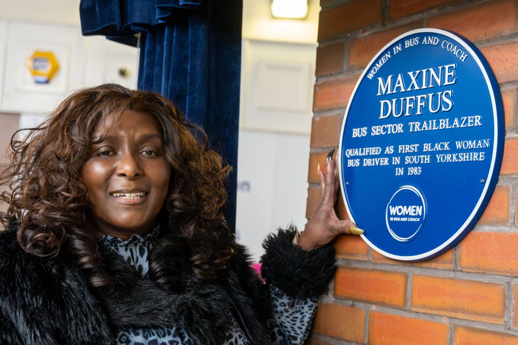 Maxine Duffus with her Women in Bus and Coach Blue Plaque at Sheffield Interchange